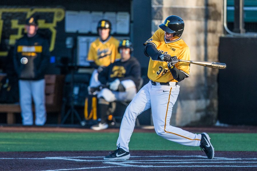 Iowa outfielder Trenton Wallace swings while at-bat during the second game of a baseball doubleheader between Iowa and Cal-State Northridge at Duane Banks Field on Sunday, March 17, 2019. 