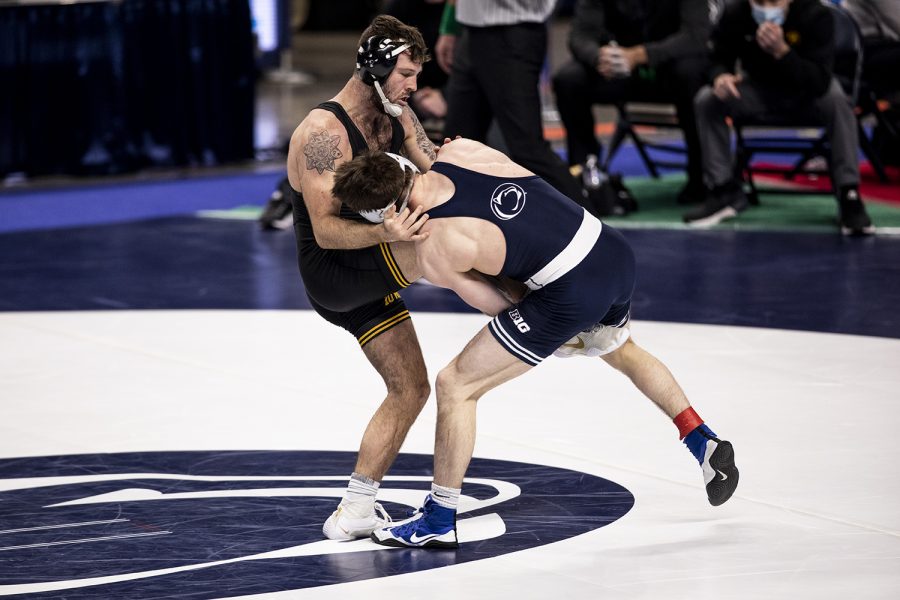 Iowa’s Jaydin Eierman defends against a single leg from Penn State’s Nick Lee during the finals of the Big Ten Wrestling Tournament at the Bryce Jordan Center in State College, PA on Sunday, March 8, 2021. Eierman won the match by decision 6-5. Ryan Adams/The Daily Iowan)