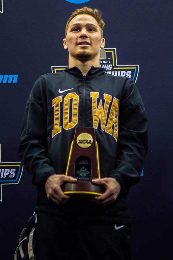 Iowas Spencer Lee holds the first-place trophy for the 125-pound weight class during the final session of the 2019 NCAA D1 Wrestling Championships at PPG Paints Arena in Pittsburgh, PA on Saturday, March 23, 2019. 