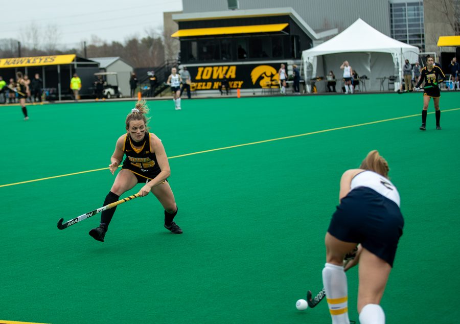 Iowa Forward Maddy Murphy attempts to block a pass from Michigan’s Clare Brush during a field hockey game between Iowa and Michigan at Grant Field on Friday, March 12, 2021. The Wolverines beat the Hawkeyes 1-0. 