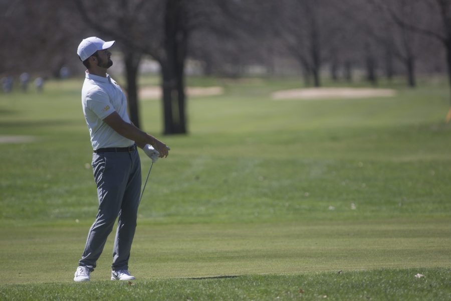 Gonzalo Leal watches the ball after driving it during a golf invitational at Finkbine Golf Course on Saturday, April 20, 2019. Iowa came in first with a score of 593 against 12 other teams. (Hannah Kinson/The Daily Iowan)