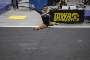 Iowas Clair Kaji performs her floor routine during a womens gymnastics meet between Iowa, Minnesota, and Maryland on Saturday, Feb. 13, 2021 at Carver Hawkeye Arena. The Hawkeyes came in second with a score of 196.775 after the Gophers won with 196.975 and Maryland lost with 195.350. Kaji received a score of 9.900. 