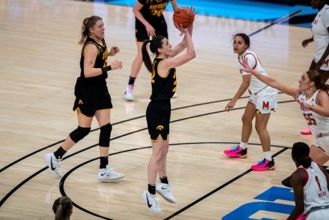 Iowa Guard Caitlin Clark (22) shoots the ball during the first half of the championship game of the Big Ten women’s basketball tournament. Iowa, ranked No. 6, took on No. 1 seeded Maryland in Indianapolis at the Bankers Life Fieldhouse Saturday afternoon. 