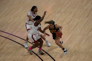 Iowa Guard Gabbie Marshall (24) charges towards the basket during a quarterfinal game of the Big 10 women’s basketball tournament. Iowa, ranked No. 6, took on No. 3 seeded Rutgers in Indianapolis at the Bankers Life Fieldhouse Thursday night. (Kate Heston/The Daily iowan