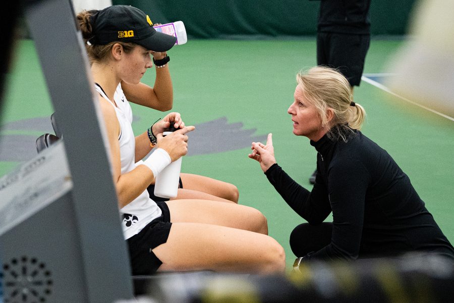 Iowa head coach Sasha Schmid talks to her team during a women's tennis match between Iowa and Colorado at the HTRC on Sunday, Feb. 16, 2020.
