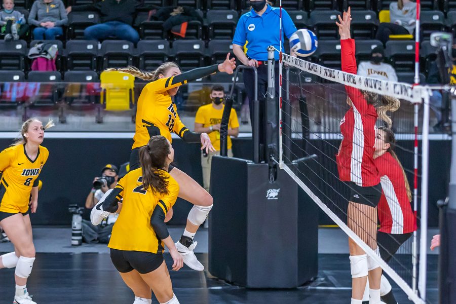 Iowa Middle Blocker Hannah Clayton hits the ball over the net during the Iowa Volleyball game against Indiana on Feb. 6, 2021 at Xtream Arena. Indiana defeated Iowa 3-2. 