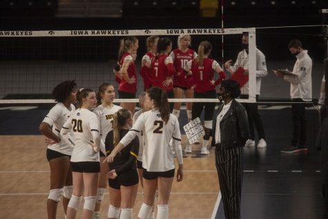 Iowa head coach Vicki Brown talks to players from the sidelines during the Iowa vs Rutgers match at Xtream Arena on Feb. 19, 2021. Iowa defeated Rutgers, 3-1.