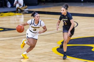 Iowa Guard Alexis Sevillian dribbles the ball down the court during the Iowa Women’s Basketball game against Northwestern on Jan. 28, 2021 at Carver-Hawkeye Arena. Northwestern defeated Iowa 87-80