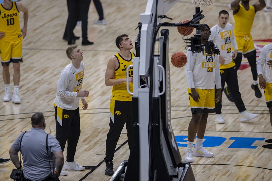 Iowa players warm up before the Big Ten men's basketball tournament quarterfinals against Wisconsin on Friday, March 12, 2021 at Lucas Oil Stadium in Indianapolis.