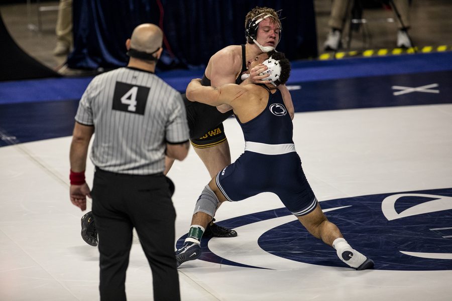 Iowa’s Nelson Brands struggles for control in the neutral position against Penn State’s Aaron Brooks during the opening session of the Big Ten Wrestling Tournament at the Bryce Jordan Center in State College, PA on Saturday, March 6, 2021. Brooks won the match by decision 14-8. The Hawkeyes ended the first session with a team score of 75.5, putting them in first ahead of second place, Nebraska, with a score of 63. 