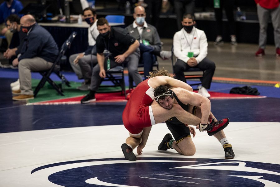 Iowa%E2%80%99s+Tony+Cassiopi+shoots+a+single+leg+on+Wisconsin%E2%80%99s+Trent+Hillger+during+the+opening+session+of+the+Big+Ten+Wrestling+Tournament+at+the+Bryce+Jordan+Center+in+State+College%2C+PA+on+Saturday%2C+March+6%2C+2021.+Cassiopi+won+the+match+by+major+decision+9-1.+The+Hawkeyes+ended+the+first+session+with+a+team+score+of+75.5%2C+putting+them+in+first+ahead+of+second+place%2C+Nebraska%2C+with+a+score+of+63.+