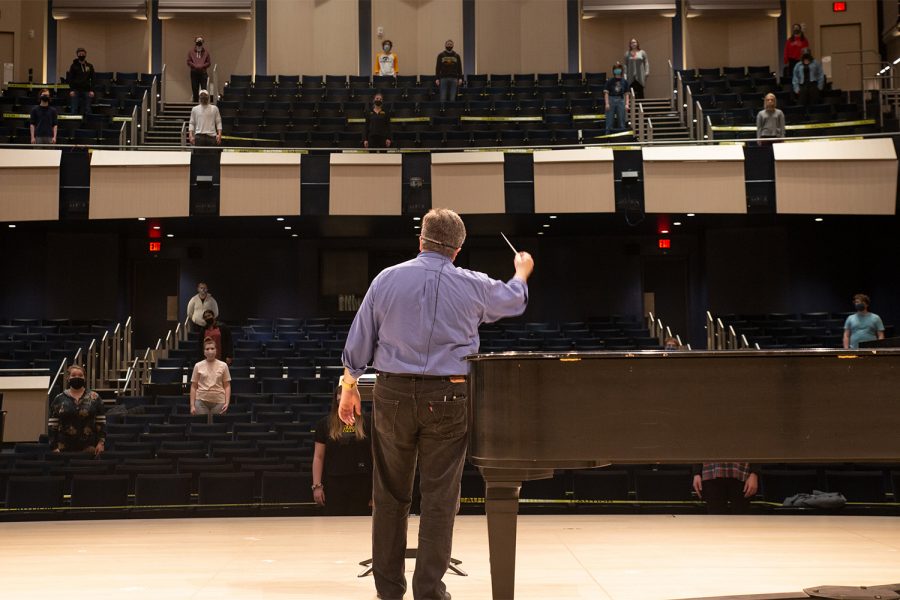 Music Director Timothy Stalter conducts the University Choir at the Voxman Music Building on March 25, 2021.