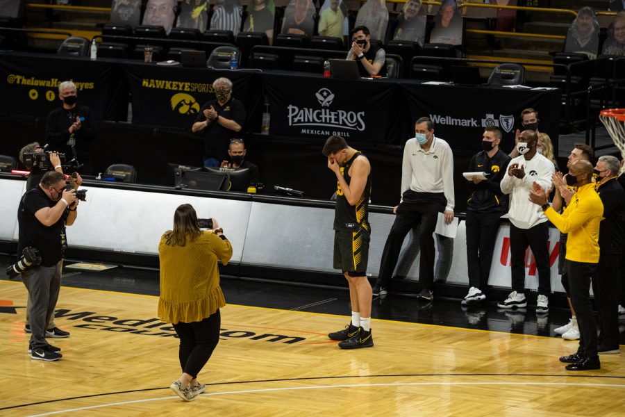 Iowa forward Luka Garza learns that his jersey number 55 will be retired after the season during a mens basketball game between Iowa and Wisconsin at Carver-Hawkeye Arena on Sunday, March 7, 2021. The Hawkeyes, celebrating senior day, defeated the Badgers, 77-73.
