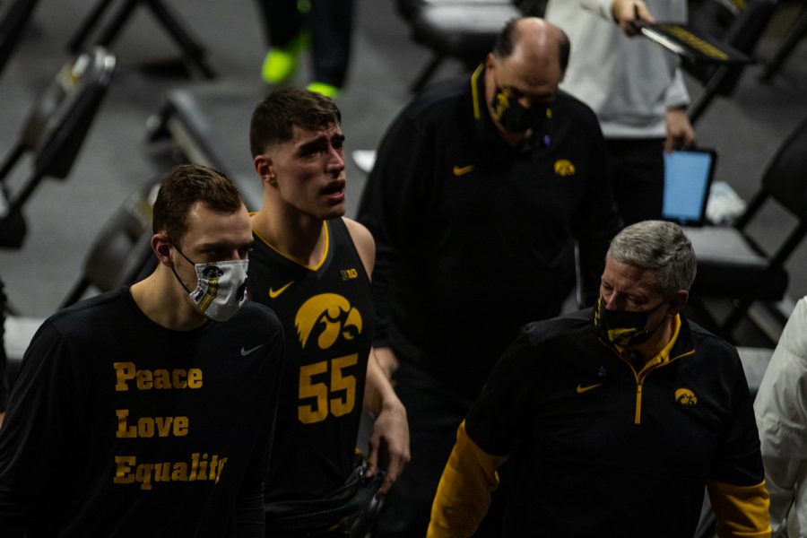 Iowa forward Luka Garza walks to the locker room after a mens basketball game between Iowa and Wisconsin at Carver-Hawkeye Arena on Sunday, March 7, 2021. The Hawkeyes, celebrating senior day, defeated the Badgers, 77-73.