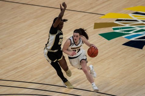 Iowa Guard Caitlin Clark (22) charges to the basket during a second round game of the Big 10 women’s basketball tournament. Iowa, ranked #6, took on #11 Purdue in Indianapolis at the Bankers Life Fieldhouse Wednesday night. The Hawkeyes beat the Boilermakers, 83-72, advancing the Hawks to take on Rutgers Thursday night in the Big 10 quarterfinals.