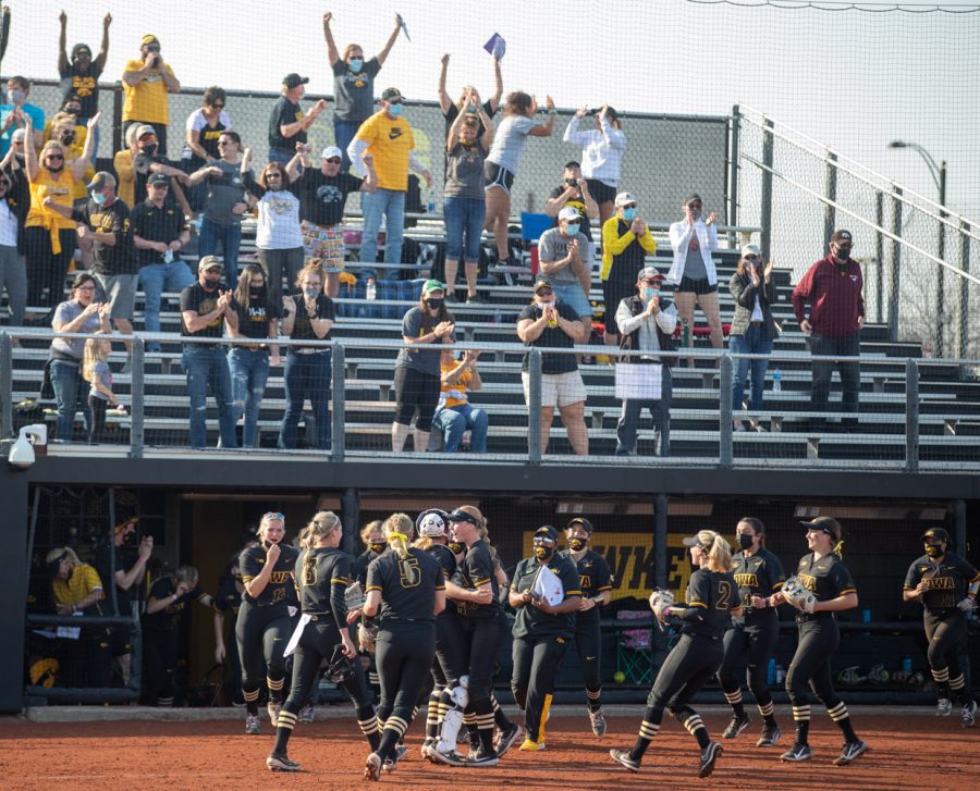 Iowa players and fans celebrate after a softball game between Iowa and Indiana at Pearl Field on Saturday, April 3, 2021. The Hawkeyes defeated the Hoosiers 1-0.