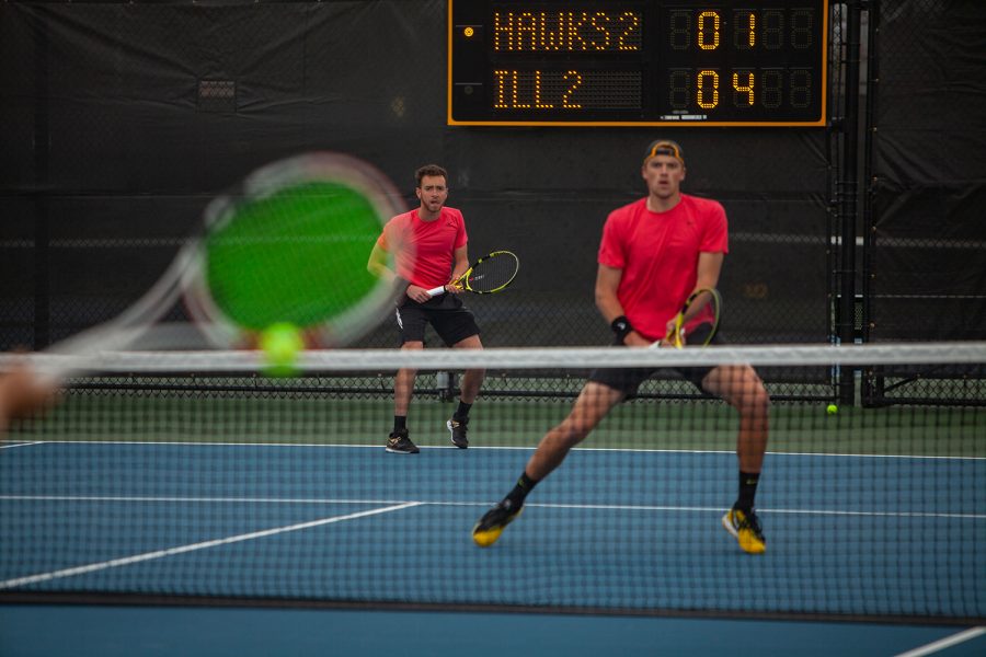 Iowa’s Kareem Allaf (left) and Joe Tyler (right) prepare to receive the ball during a men’s tennis meet between Iowa and  No. 14 Illinois on Friday, April 9 at the Hawkeye Tennis and Recreation Complex. The Fighting Illini defeated the Hawkeyes 5-2. 