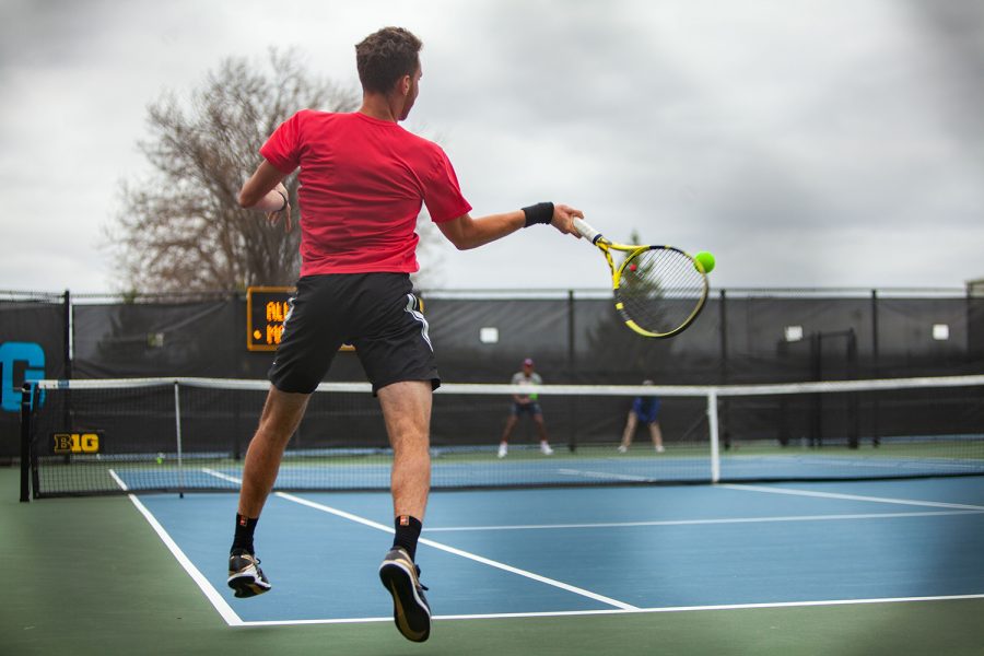 Iowa’s Kareem Allaf prepares to return the ball during a men’s tennis meet between Iowa and No. 14 Illinois on Friday, April 9 at the Hawkeye Tennis and Recreation Complex. The Fighting Illini defeated the Hawkeyes 5-2. (Ayrton Breckenridge/The Daily Iowan)