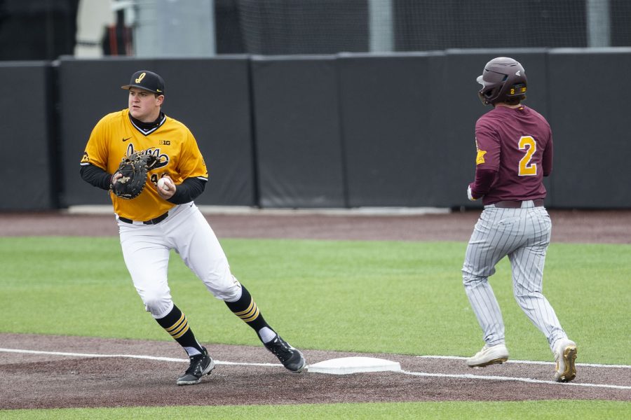 Iowa first basemen Peyton Williams gets Minnesota infielder Zack Raabe out during the Iowa baseball game vs. Minnesota at the Duane Banks Field in Iowa City on April 11, 2021. 