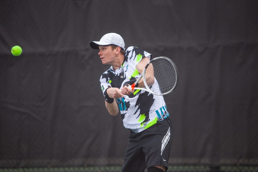 Iowa’s Jason Kerst prepares to hit the ball during a men’s tennis meet between Iowa and Northwestern on Sunday, April 11 at the Hawkeye Tennis and Recreation Complex. The Wildcats defeated the Hawkeyes 6-1. 