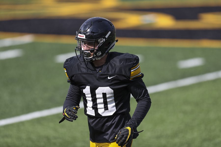 Iowa wide receiver Arland Bruce IV does a drill during Iowa football spring practice on Saturday, April 17, 2021 in Kinnick Stadium.