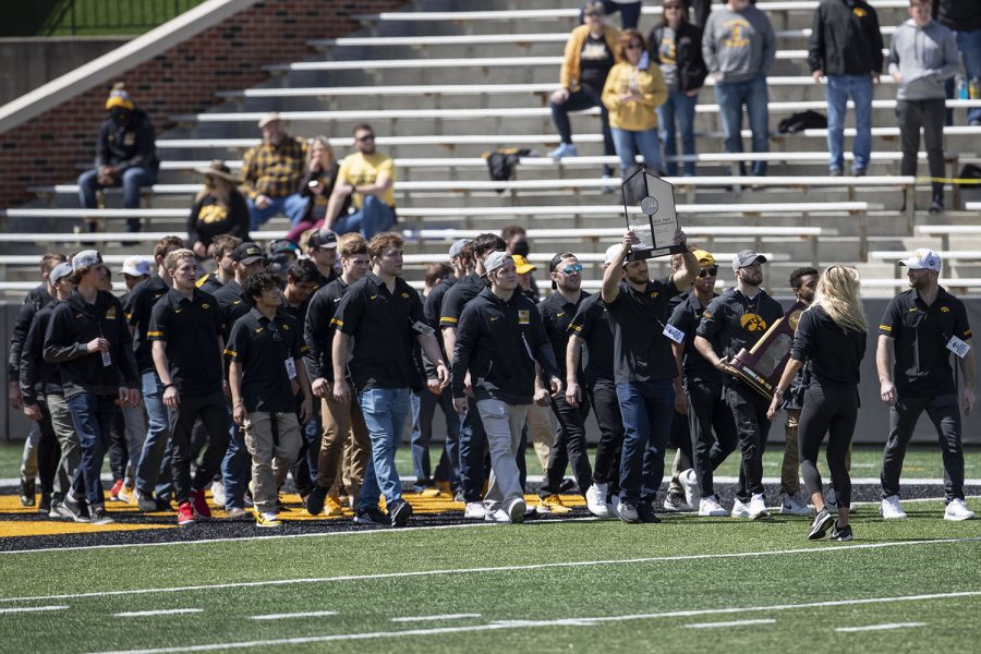The Iowa wrestling team takes the field to be honored after Iowa football spring practice on Saturday, April 17, 2021 in Kinnick Stadium.