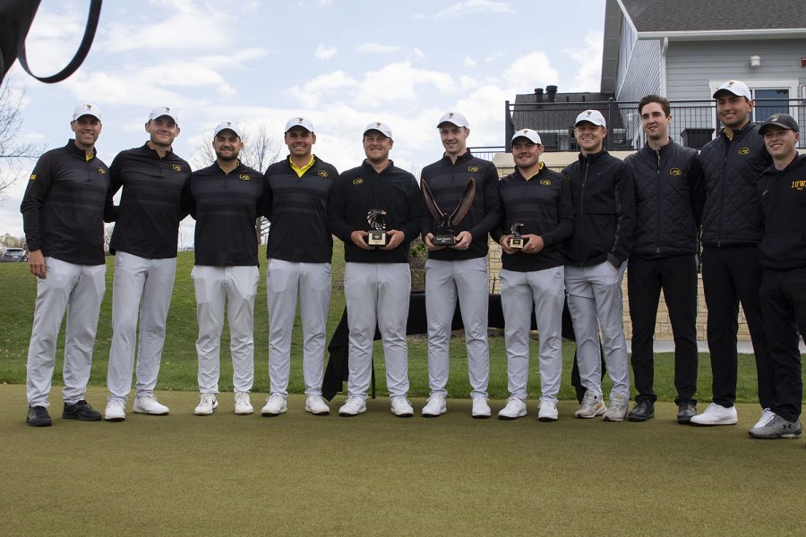 The Iowa men’s golf team poses with their trophies after the third round of the Hawkeye Invitationals at Finkbine Golf Course on Sunday, April 18, 2021.