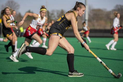 Iowa midfielder Esme Gibson runs down the field with the ball during the second quarter of a field hockey game against Maryland on Friday, April 2, 2021 at Grant Field. The Hawkeyes were defeated by the Terrapins, 1-0.