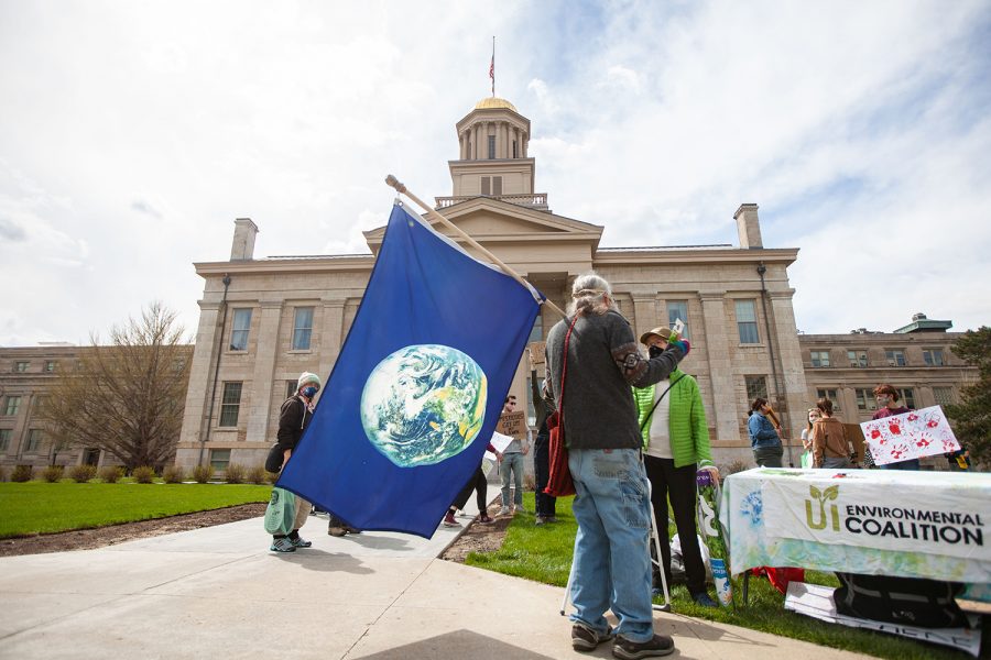 University of Iowa Environmental Coalition members and 100 Grannies members protest on the Pentacrest on Friday, April 16, 2021, over the use of pesticides. The groups listed all the pesticides used on campus along with their health and environmental effects.