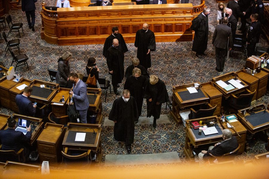 Members of the Iowa Supreme Court exit the house chamber following the State of the State address at the Iowa State Capitol on Tuesday, Jan. 12, 2021 in Des Moines. Gov. Reynolds highlighted in the address expansion of broadband internet, a push for in-person learning, and economic recovery from the COVID-19 pandemic.