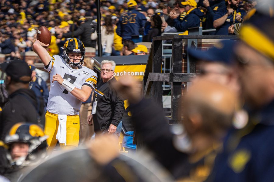 Iowa quarterback Spencer Petras warms up on the sideline during a football game between Iowa and Michigan in Ann Arbor on Saturday, October 5, 2019. The Wolverines celebrated homecoming and defeated the Hawkeyes, 10-3. (Shivansh Ahuja/The Daily Iowan)