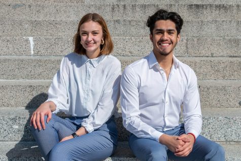 University of Iowa students José Muñiz Jr. and Regan Smock pose for a portrait outside of the Old Capitol building on Sunday afternoon. Muñiz Jr. and Smock are running for office in the upcoming University Student Government election. 