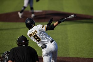 Iowa baseball player Ben Norman hits the ball during a baseball game in Iowa City against Northwestern. The Hawks beat the Wildcats, 9-8. (Kate Heston/The Daily Iowan)