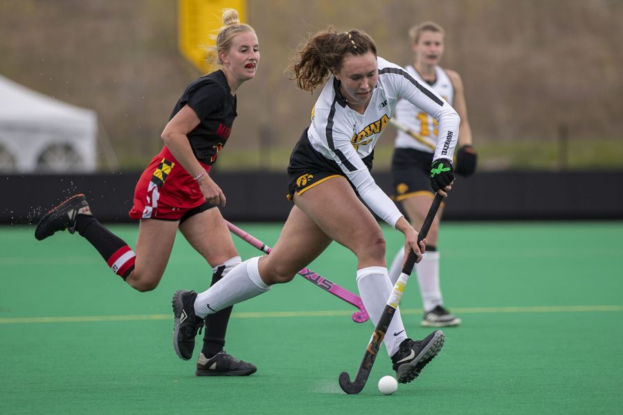 Iowa midfielder Harper Dunne runs up the field with the ball during the fourth quarter of the Big Ten field hockey tournament quarterfinals against No. 4 Maryland on Wednesday, April 21, 2021 at Grant Field. The Hawkeyes defeated the Terrapins, 3-0. No. 5 Iowa will go on to play No. 1 Michigan tomorrow afternoon.