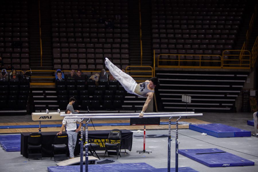 Iowa+all+around+Bennet+Huang+performs+on+the+parallel+bars+on+Saturday%2C+Feb.+20%2C+2022+during+the+Iowa+vs.+Penn+State+men%E2%80%99s+gymnastics+meet+at+Carver-Hawkeye+Arena.+Iowa+defeated+Penn+State+398.850-393.550.+Huang+tied+for+first+overall+with+teammate+Carter+Tope+with+a+final+score+of+13.350.+