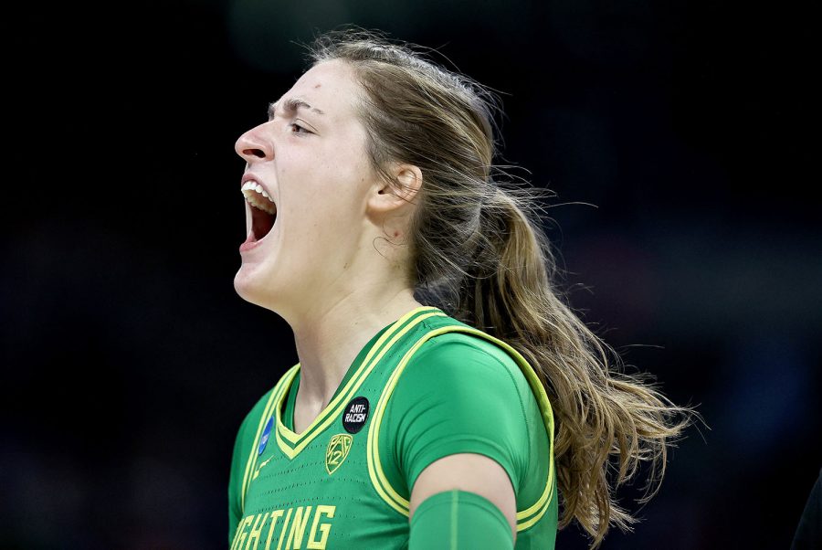 Sedona Prince (32) of the Oregon Ducks screams before the start of the game against the Louisville Cardinals during the Sweet Sixteen round of the NCAA Womens Basketball Tournament at the Alamodome on March 28, 2021 in San Antonio, Texas. (Elsa/Getty Images/TNS)