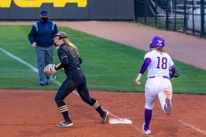 Iowa utility player Denali Loecker steps on the base to get Northwestern’s pitcher/utility player Morgan Newport out during the Iowa Softball game against Northwestern on April 17, 2021 at Bob Pearl Field. Northwestern defeated Iowa 7-4.