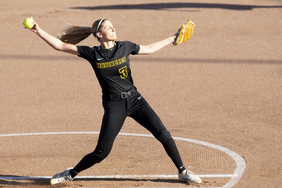 Pitcher Allison Doocy warms up during the Iowa softball fall opener against Des Moines Area Community College. The Hawkeyes beat the Bears 4-1 in 10 innings. 