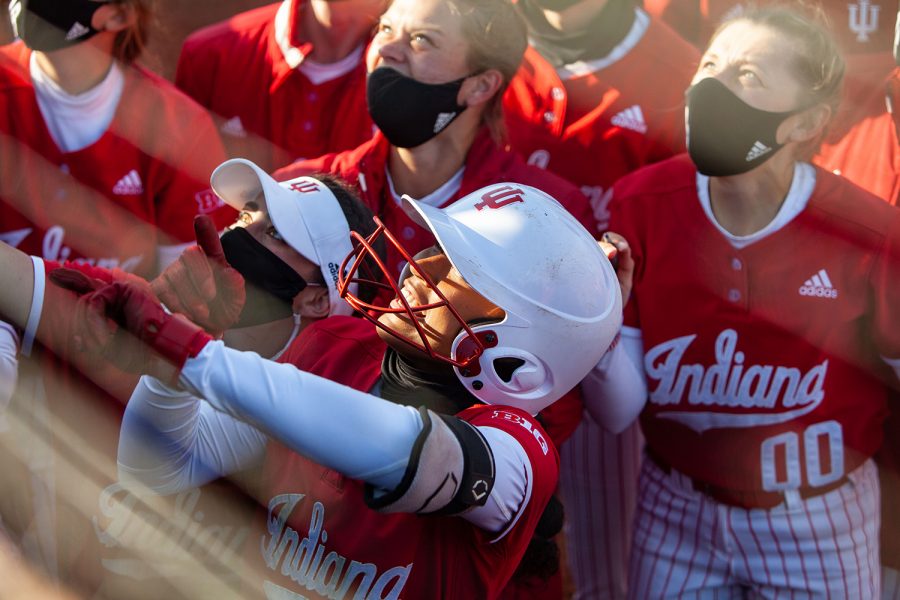 Indiana outfielder Aaliyah Andrews celebrates with fans after hitting a home run during a softball game between Iowa and Indiana at Bob Pearl Softball Field on Friday, April 2. After nine innings of play, the Hoosiers defeated the Hawkeyes 4-1.