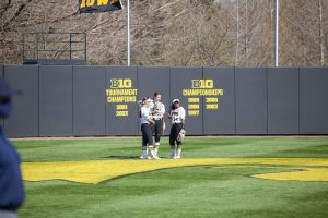 (left to right) Iowas Riley Sheehy, Brylee Klosterman and Nia Carter confer during a softball game between Iowa and Indiana at Bob Pearl Softball Field on Sunday, April 4th. The Hawkeyes defeated the Hoosiers 2-1 in extra innings