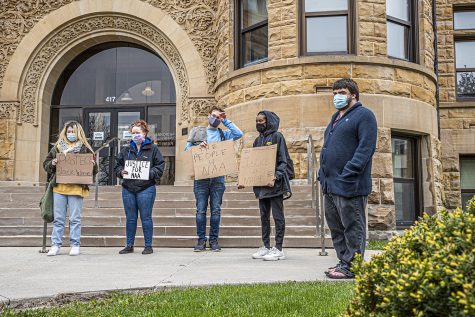 A group of protesters gather outside of the Johnson County Courthouse to advocate for Iowa City resident, Naa Adjeiwa Tackie on Monday, April 19, 2021.  