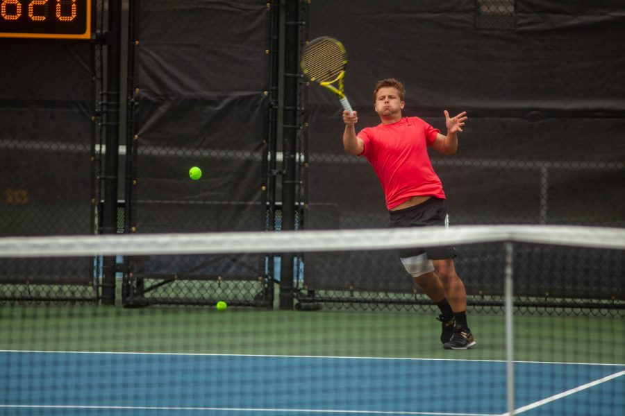 Iowa’s Will Davies hits the ball during a men’s tennis meet between Iowa and No. 14 Illinois on Friday, April 9, 2021 at the Hawkeye Tennis and Recreation Complex. The Fighting Illini defeated the Hawkeyes 5-2.