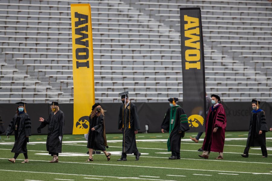 University of Iowa deans, presidents, and regents members enter Kinnick during the University of Iowa’s celebration of graduates Sunday, May 16, 2021, at Kinnick Stadium. (Kate Heston/The Daily Iowan)