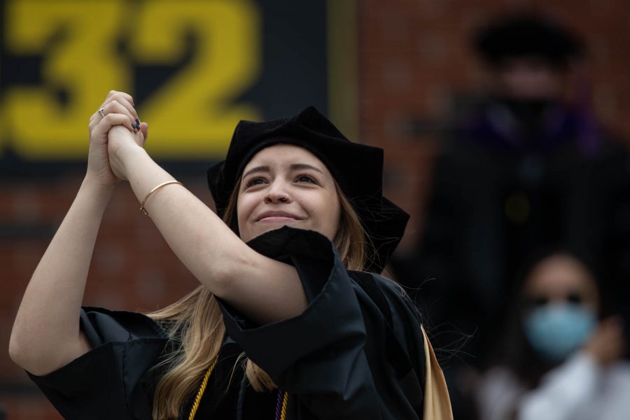 A student celebrates during the University of Iowa’s celebration of graduates Sunday, May 16, 2021, at Kinnick Stadium. (Kate Heston/The Daily Iowan)