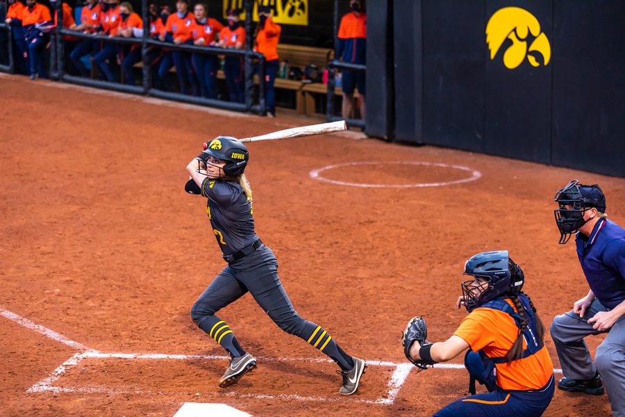 Iowa infielder Aralee Bogar watches to see if her hit is in bounds during the Iowa Softball game against Illinois on May 14, 2021 at Bob Pearl Field. Iowa defeated Illinois 3-1. 