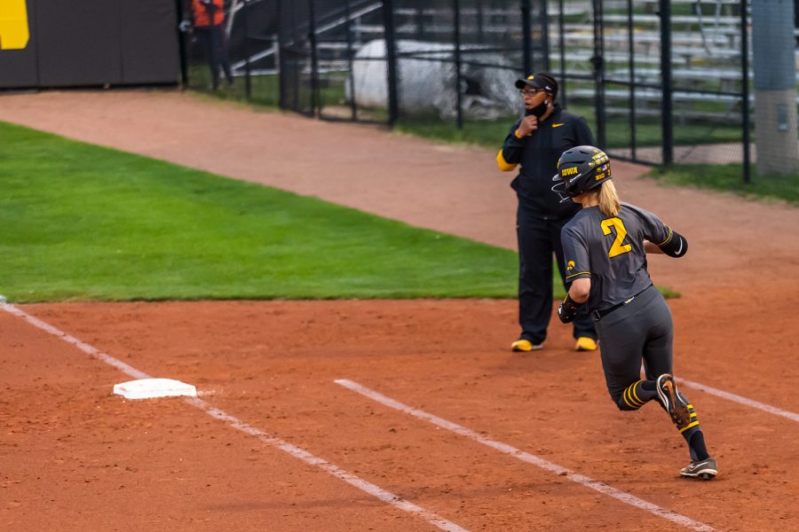 Iowa infielder Aralee Bogar runs to first base during the Iowa Softball game against Illinois on May 14, 2021 at Bob Pearl Field. Iowa defeated Illinois 3-1. 