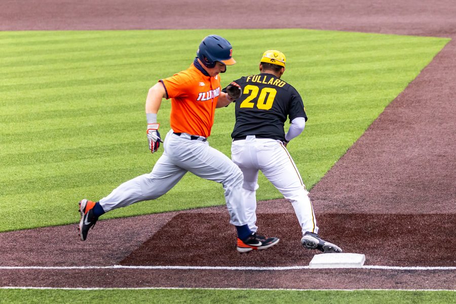 Iowa infielder Izaya Fullard catches the ball for an out at first base during the Iowa Baseball game against Illinois on May 15, 2021 at Duane Banks Field. Illinois defeated Iowa 14-1.