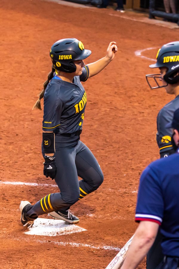 Iowa outfielder Riley Sheehy scores a run during the Iowa Softball game against Illinois on May 14, 2021 at Bob Pearl Field. Iowa defeated Illinois 3-1. 