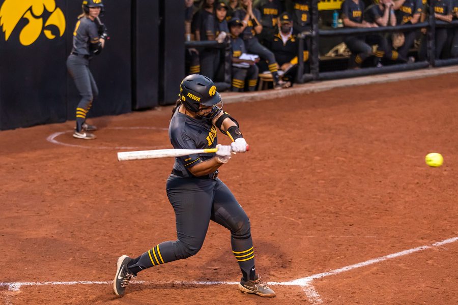 Iowa utility player Marissa Peek hits ball during the Iowa Softball game against Illinois on May 14, 2021 at Bob Pearl Field. Iowa defeated Illinois 3-1. 