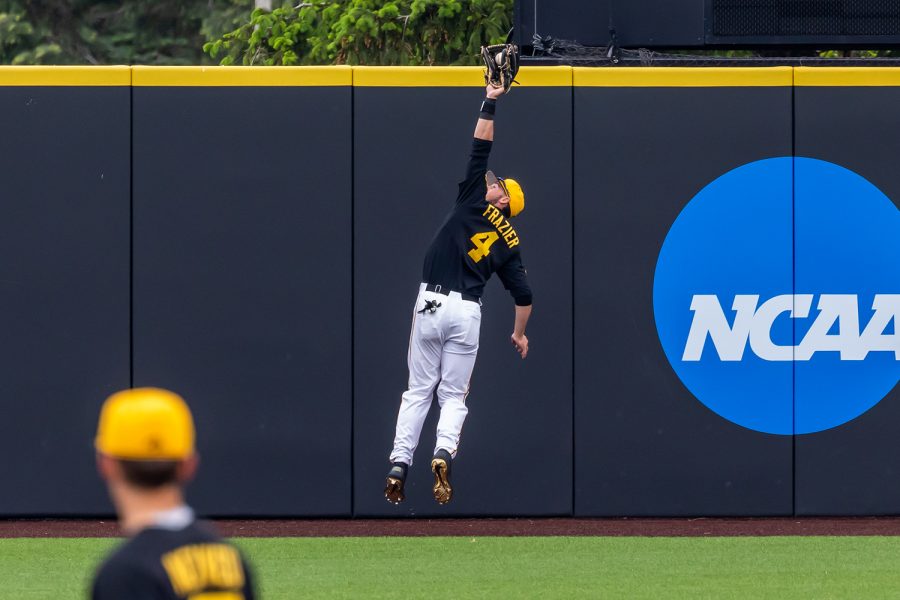 Iowa infielder/outfielder Brayden Frazier jumps to catch a fly ball during the Iowa Baseball game against Illinois on May 15, 2021 at Duane Banks Field. Illinois defeated Iowa 14-1. 